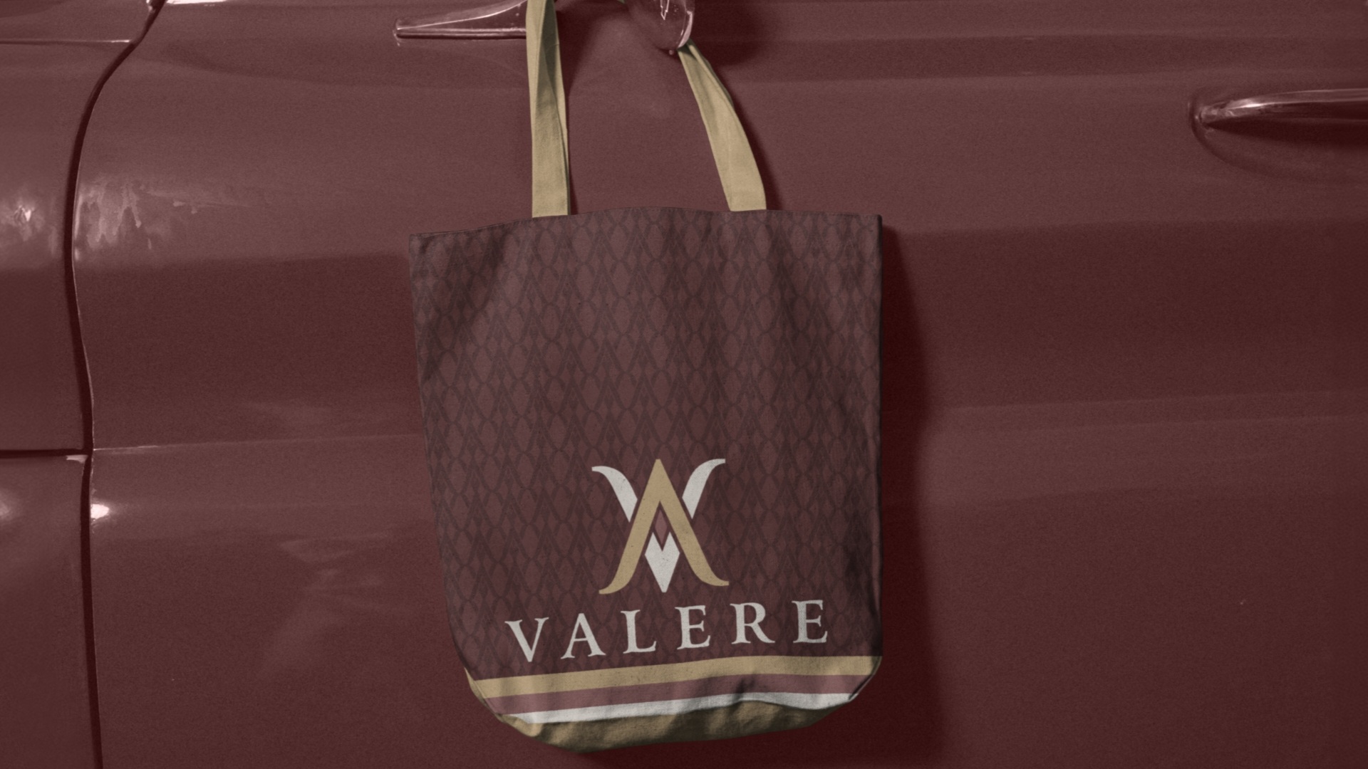 Cotton shopping bag with Valere logo hanging from classic car mirror – fashion branding and visual identity design by Wotbbi.