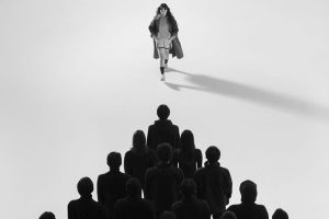 Women facing lots of people, representing the Second Principle of Wotbbi's 7 Principle of Fashion Branding: The Boundary Principle.