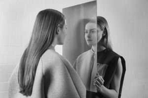 Women in front of a mirror, representing the First Principle of Wotbbi's 7 Principle of Fashion Branding: The Identity Principle.